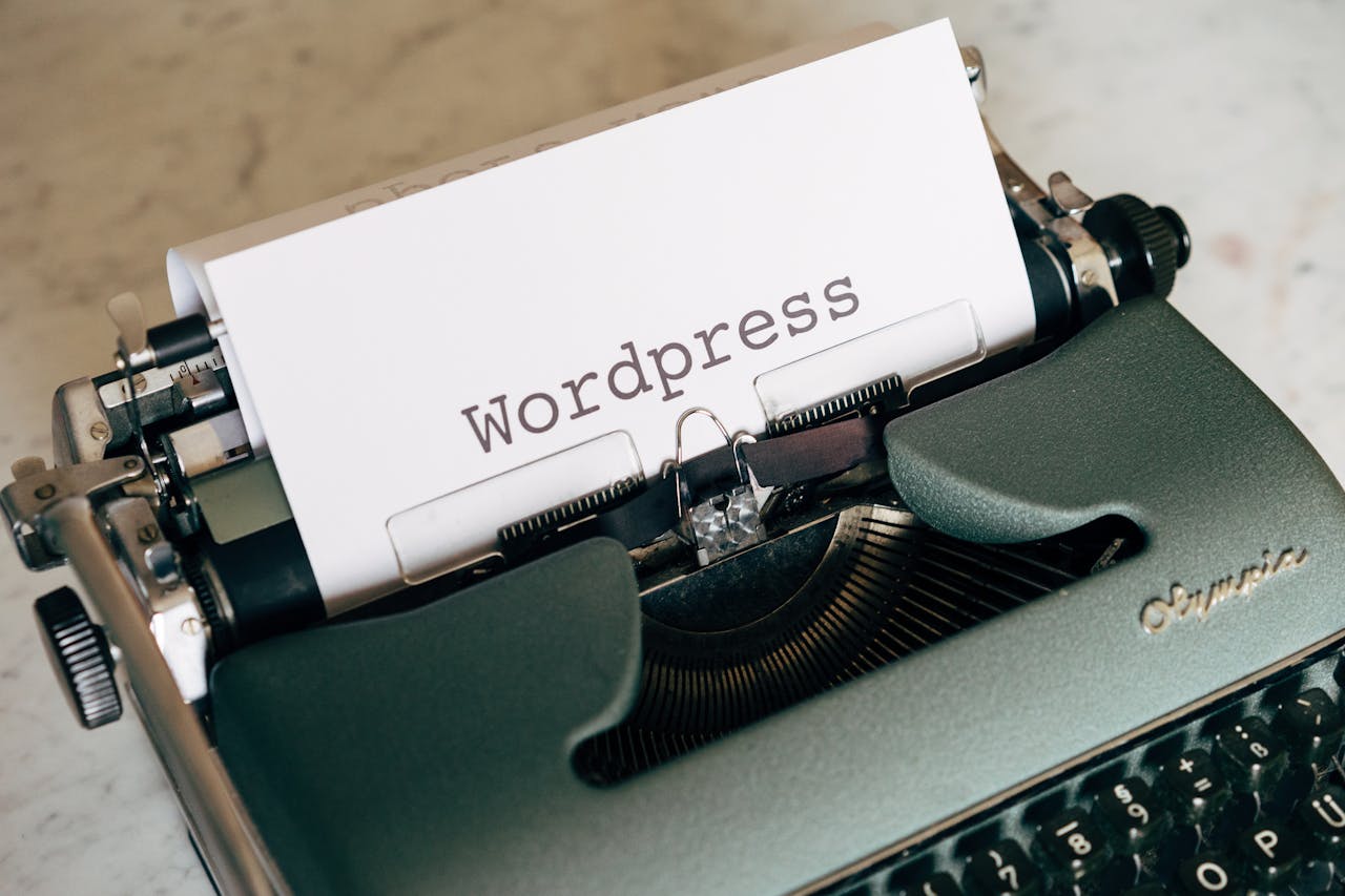 Close-up of a vintage typewriter with paper labeled Wordpress.